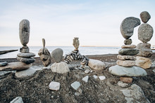 Figures Of Stones On The Beach. Beautiful Figures Of Stones On The Background Of The Sea.