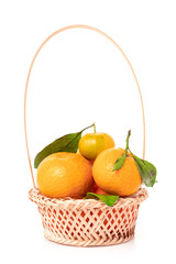 Wall Mural - tangerines  with leaves in a beautiful basket. organic ripe mandarins