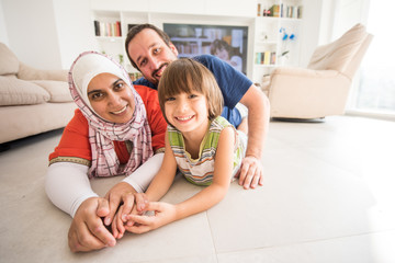 Wall Mural - Mother father and son as a happy family at home