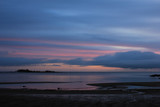 Fototapeta Dmuchawce - Cloudy morning at the shore of Lake Vanern, Sweden.