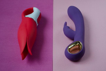 Vibrators. Dildos with vibration. Sex toys for women on color background. Useful for sex shop