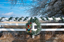 Christmas Wreath On Fence On Frosty Day
