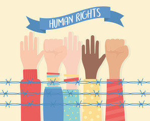 human rights, raised and fist hands diversity behind barbed wire