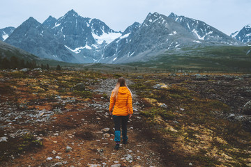 traveler woman hiking in mountains outdoor adventure vacations alone active healthy lifestyle girl e