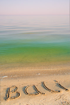 The inscription Bali on sand. 