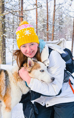 Poster - Woman with Husky family dog sled in winter Rovaniemi of Finland of Lapland. Person and Dogsled ride in Norway. Animal Sledding on Finnish farm, Christmas. Sleigh. Safari on sledge and Alaska landscape