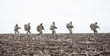 © Getmilitaryphotos - Army soldiers group on march in muddy field