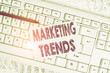 © Zofia - Word writing text Marketing Trends. Business photo showcasing changes and developments in trading in the market White keyboard office supplies empty rectangle shaped paper reminder wood