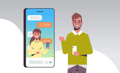 Poster - man using smartphone online conference video call with female colleague social network communication concept mobile application horizontal portrait vector illustration