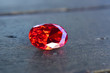  ruby Is a beautiful red gemstone on a wooden floor