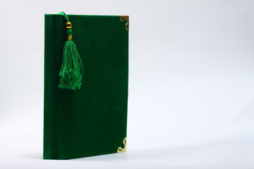 Green book on a white isolated background