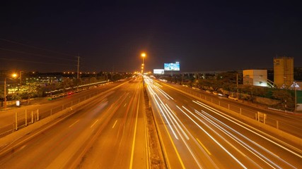 Aufkleber - Time lapse of car light trails on highway street or road in Bangkok, Thailand. Urban city at night in transportation, business, or technology concept. Fast motion speed background. Long exposure.