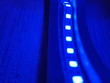 © ksenikin - Curved blue LED light strip. Bottom view.