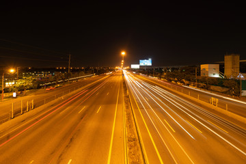 Aufkleber - Car light trails on highway street or road in Bangkok, Thailand. Urban city at night in transportation, business, or technology concept. Wallpaper fast motion speed background. Long exposure.