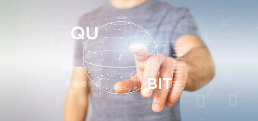 Poster - Businessman holding Quantum computing concept with qubit icon 3d rendering