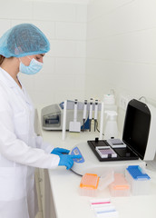 Poster - Female doctor making diagnosis of samples on high quality lab equipment