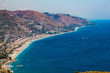 © stefano - panoramic view of the coast photographed from the amphitheater of Taormina in Sicily, Italy
