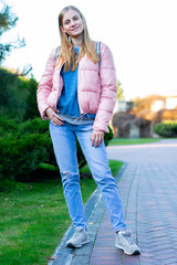 Portrait of young beautiful happy woman, autumn outdoors