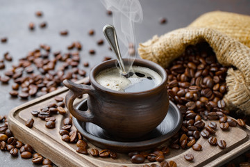 Black coffee on an old background in a cup