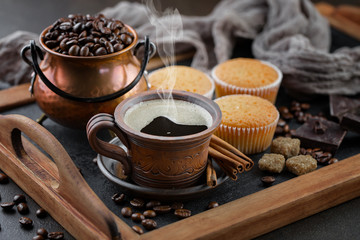 Black coffee on an old background in a cup