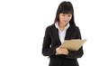 © Nipapun - Young Asian  business woman in black suit with long hair  holding document on clipboard on white background. Serious business woman looking at documents,studio isolated.