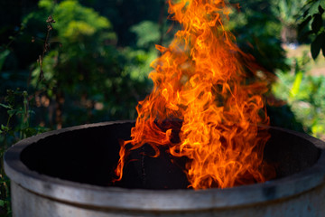 Wall Mural - Cement tank at fire flames on blurred background