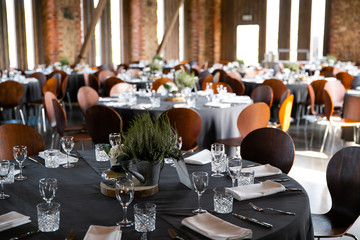 Food served on round table in a white hall during a Birthday corporate party in Eastern European Baltic Riga Latvia - Wooden ambar hall in countryside style - Canape, snacks and light drinks