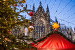 Traditional Christmas market in Europe, Cologne, Germany. Main town square with decorated tree and lights. Christmas fair concept