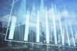 © peshkova - Forex chart on cityscape with skyscrapers wallpaper multi exposure. Financial research concept.