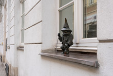 Dwarf On The Street Windowsill In Wroclaw City, Poland