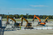 © milkovasa - The reconstruction of international airport. A group of construction machines with pneumatic hammers break the surface of Vaclav Havel Airport in Prague.