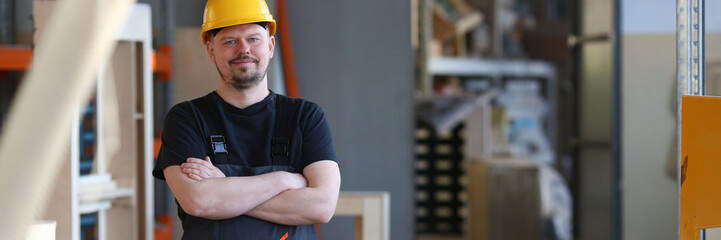 Portrait of young attractive man in work clothes