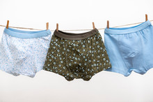 Male (boy) Brief Boxers Hanging On The Clothesline Isolated On A White Background