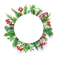 Wall Mural - flat lay composition with winter fir branches, cones, holly and blank card on white background