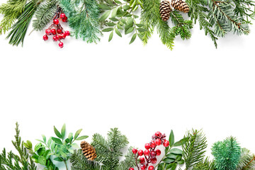 Wall Mural - flat lay composition with winter fir branches, cones, holly isolated on white background