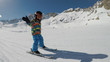 Little boy skiing..A 5 year old child enjoys a winter holiday in the Alpine resort..