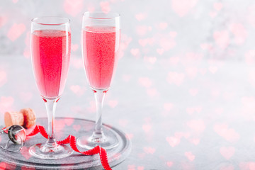 Pink cocktail with champagne or prosecco for Valentine's day.