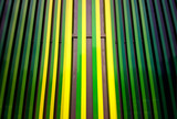 Fototapeta Sypialnia - Dramatic green & yellow metal panels background