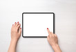 Tablet on desk in horizontal position and isolated screen for mockup, app or web site presentation. Girl touch display concept. Top view, flat lay