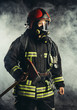 © alfa27 - strong middle-aged fireman going to save and protect people from fire, wearing special mask or helmet, protective uniform