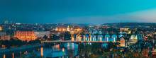 Prague, Czech Republic. Evening Panoramic View Of Evening Cityscape In Night Lighting. Charles Bridge, Manes Bridge, Straka Academy. Famous Landmarks, UNESCO World Heritage