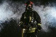 © alfa27 - brave man fire fighter extinguishing fire, work at fire station and doing his work wearing protective uniform