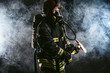 © alfa27 - strong confident fireman saving and protecting from fire, wearing protective helmet and suit, working in fire station
