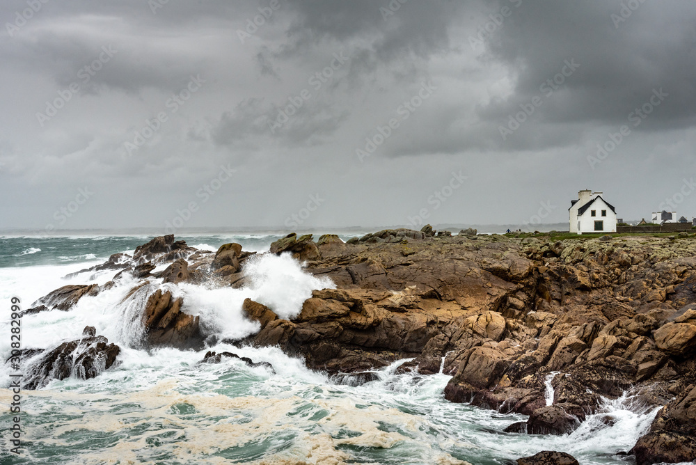 Storm on the coast in Brittany. The waves are smashing on the rocks ...