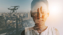 Double Exposure Of Businesswoman And Cityscape With Drone Quad Copter With High Resolution Digital Camera.