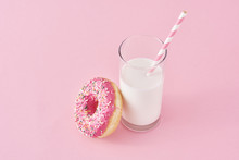 Donuts With Glass Of Milk On A Pink Background