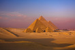 scenic panorama view of giza pyramids cairo egypt  with caravan 