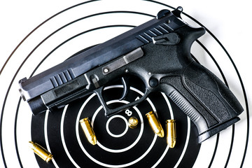 Gun with ammunition on paper target background. Guns ammo or rounds military picture top view.