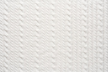 White Knit Fabric Background. Wool Sweater Texture Close Up