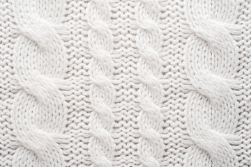 White Knit Fabric Background. Wool Sweater Texture Close Up